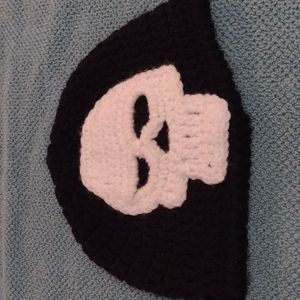 Black crochet with white skull cap. Beanie
